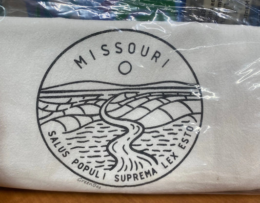A white cotton kitchen towel with the state seal of Missouri printed in the center, displaying a river and landscape design.